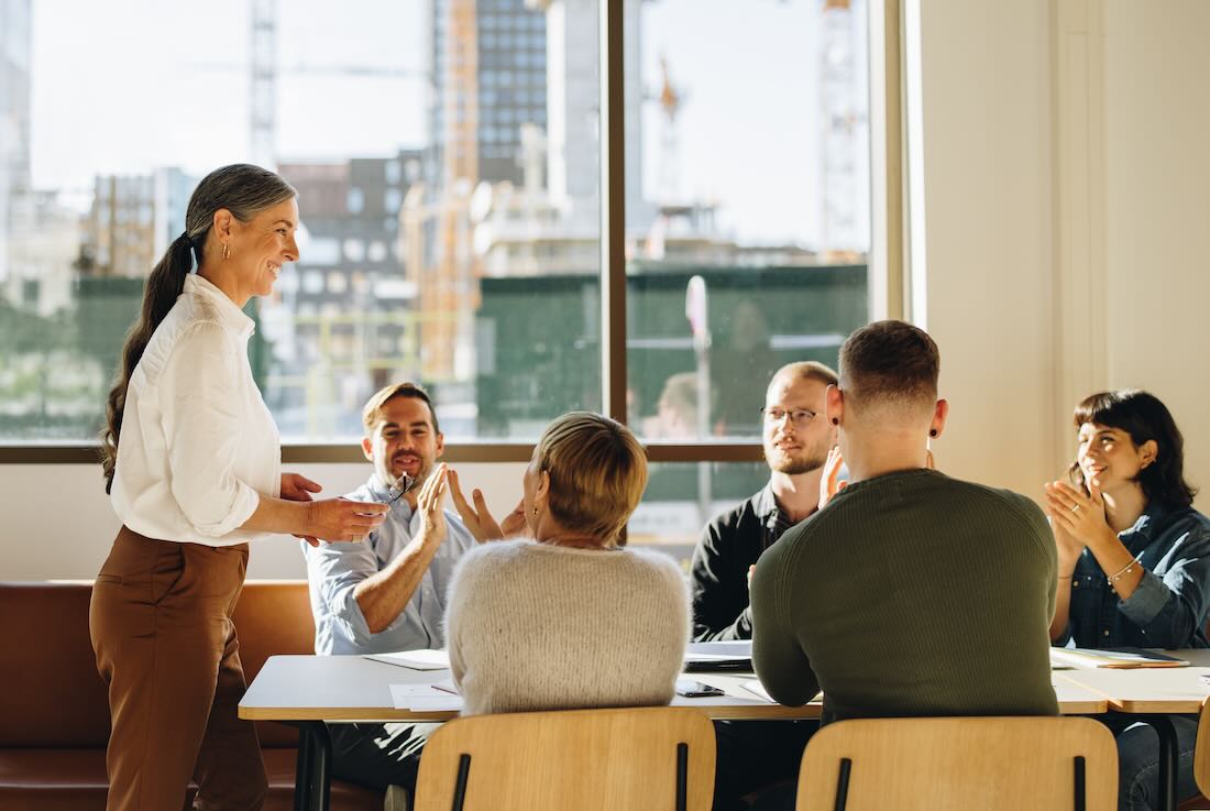 Female executive leading a business meeting with her team 